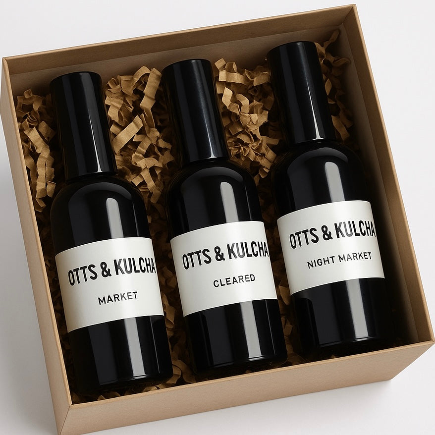 Three black bottles in a box