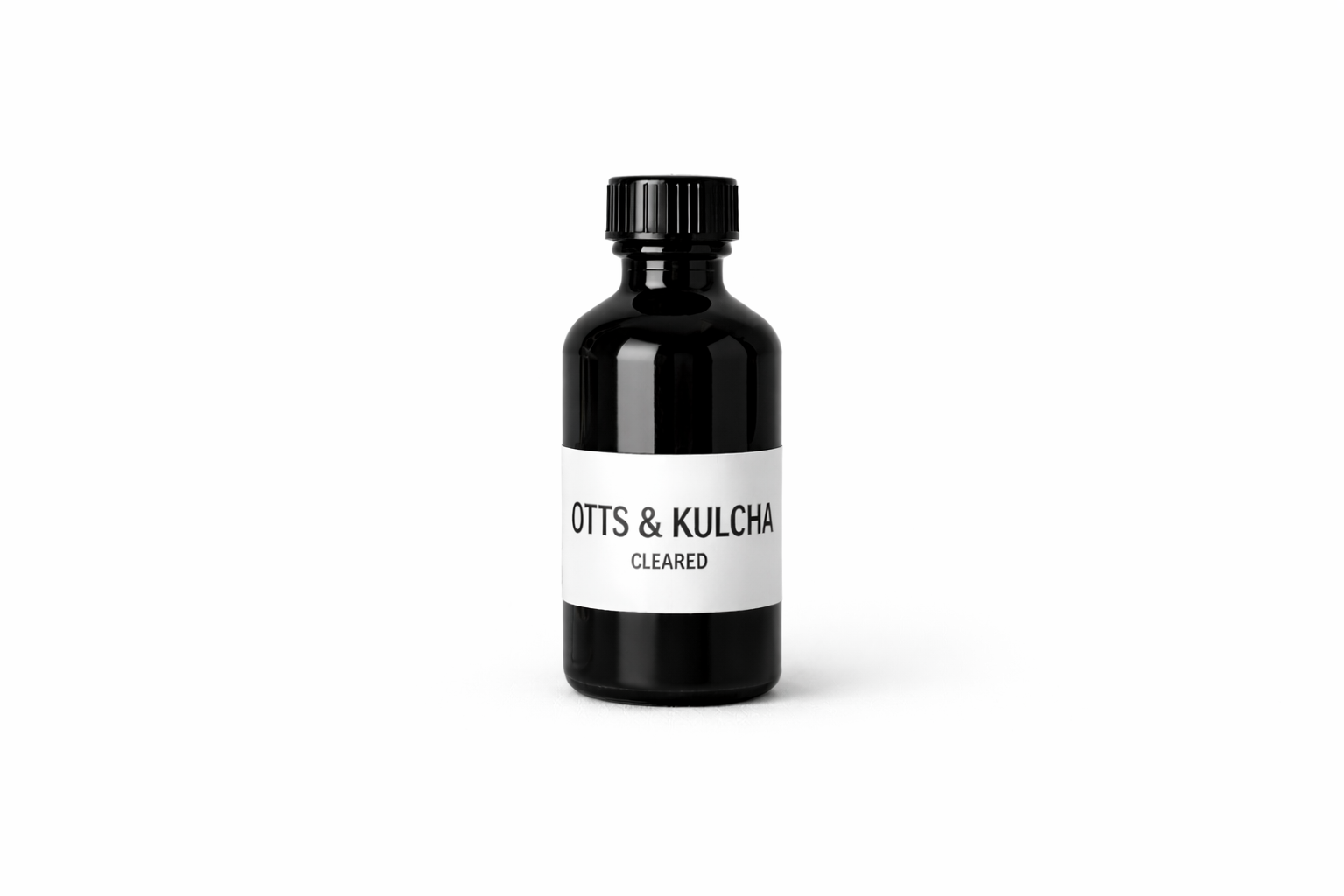 Black apothecary bottle labeled Cleared