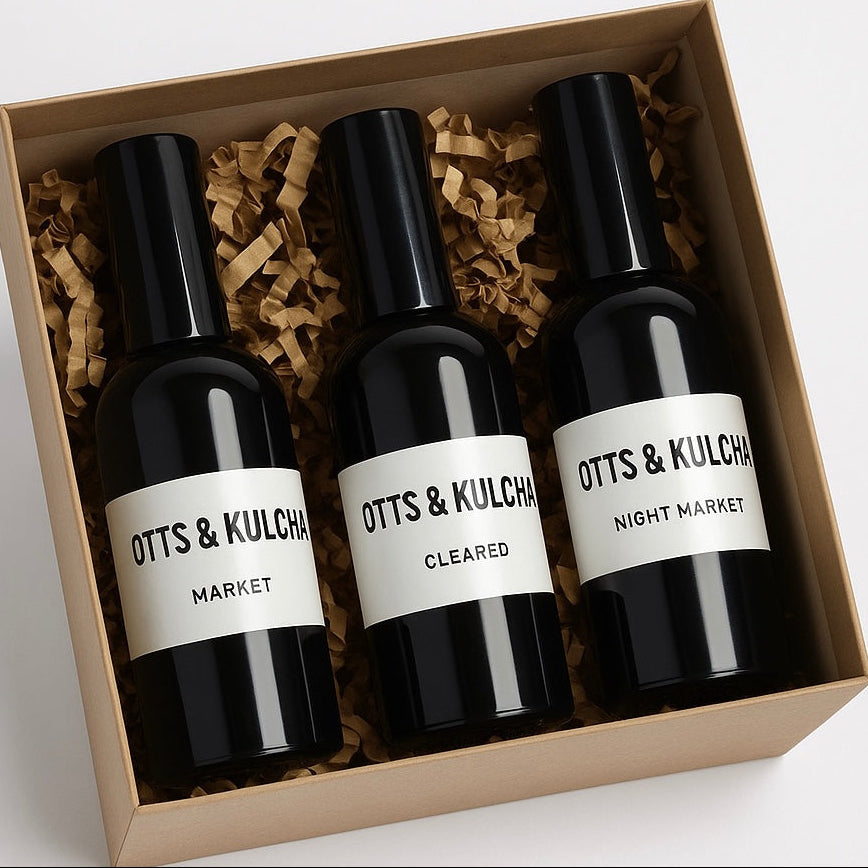 3 black spray bottles with while labels