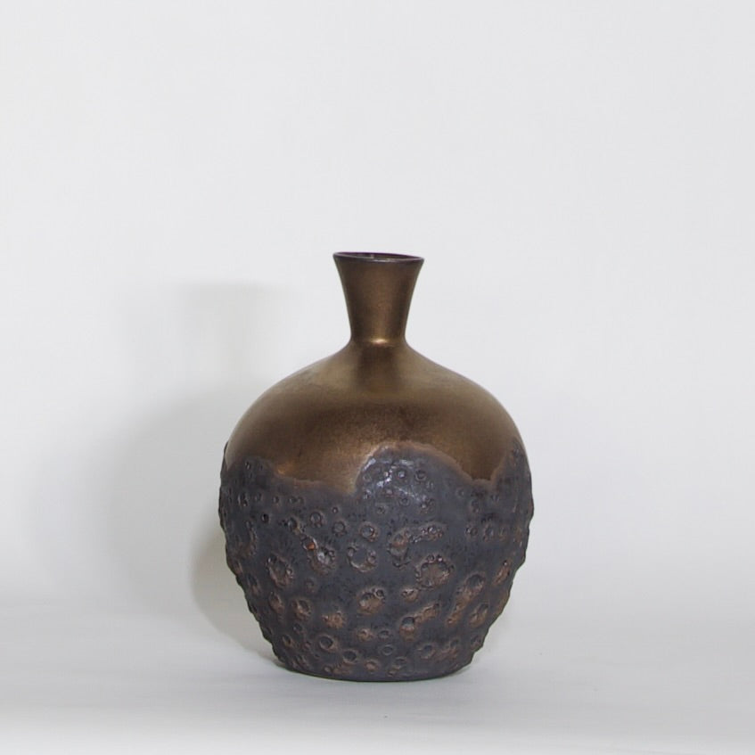 Pelagic Bottle I, one-of-one porcelain ceramic vessel with bronze and cratered Pelagic patina